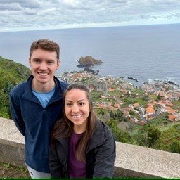 Zach and his wife at a coastal overlook